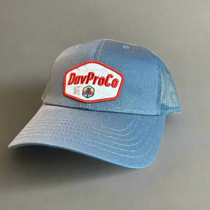 Blue cap with a red and white logo on a gray background