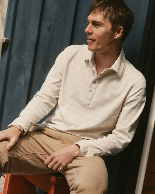 Taylor Stitch The Long Sleeve Polo in Vintage White Knit Stripe, worn