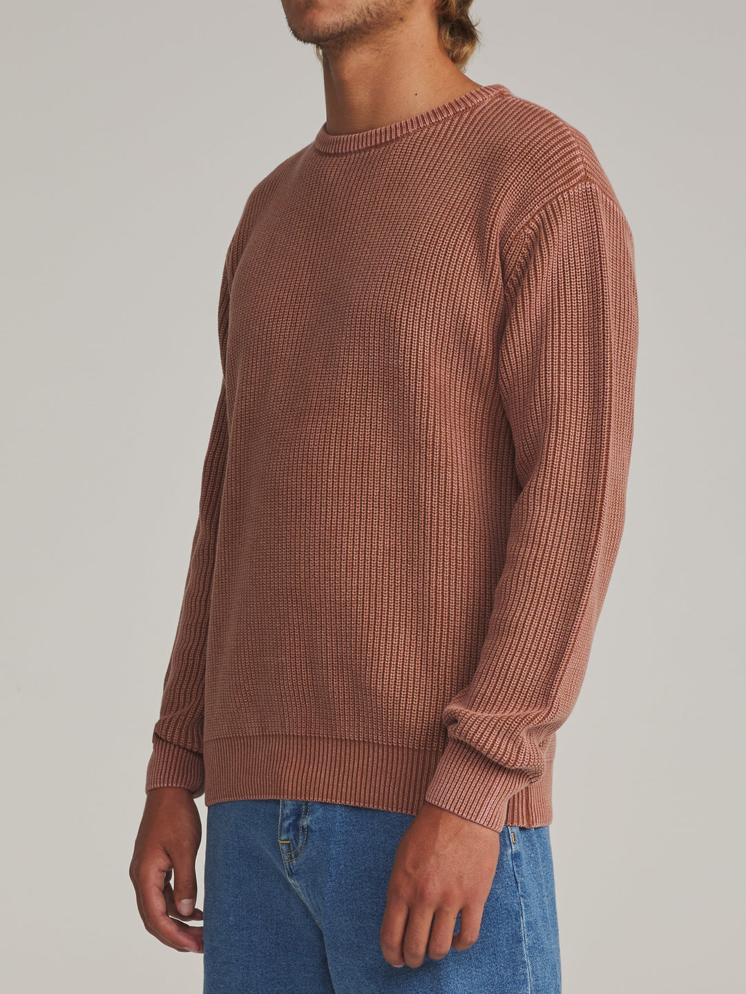 Katin Swell Sweater in Rust, worn by a model, side view